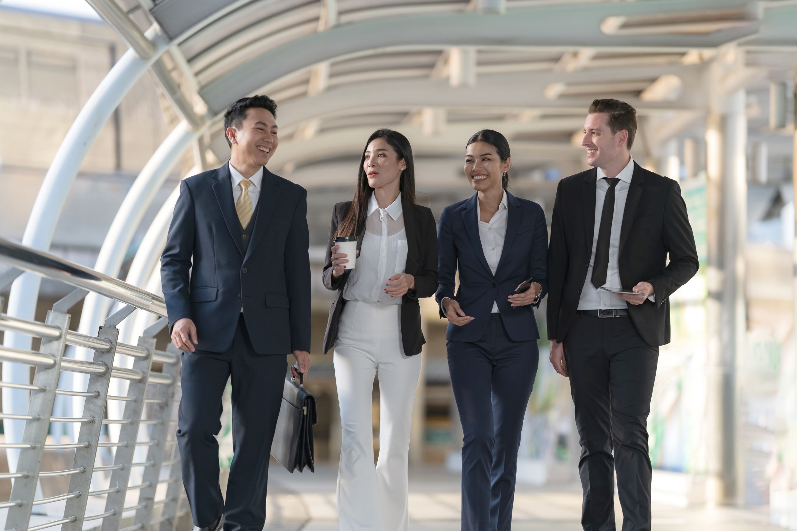 Business people walking and talk to each other in front of moder Business people walking and talk to each other in front of modern office, Leadership Concept, Business success win result